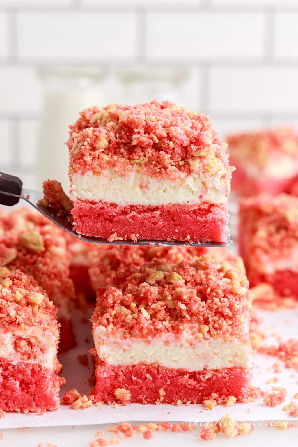 strawberry cheesecake brownies stacked on top of each other