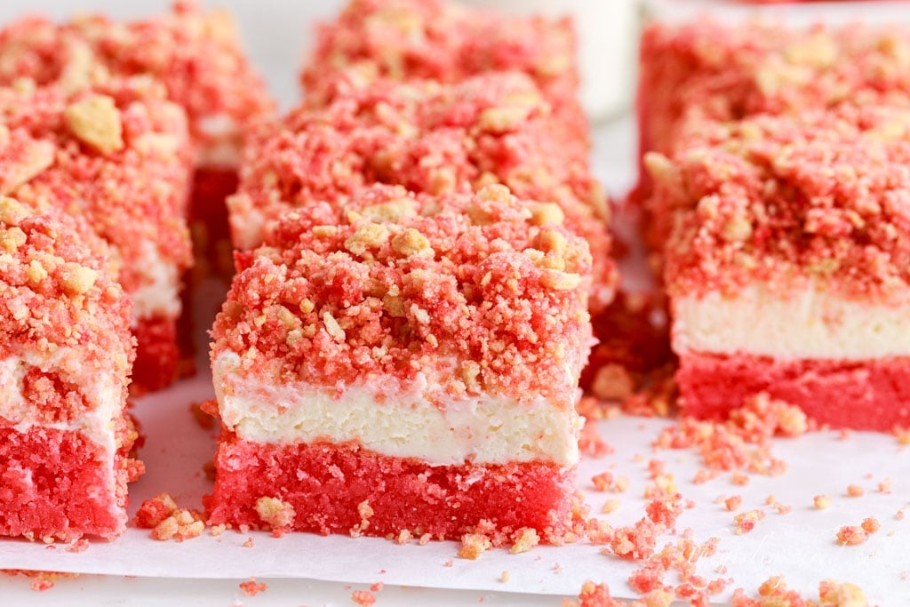 strawberry cheesecake brownie squares on a plate