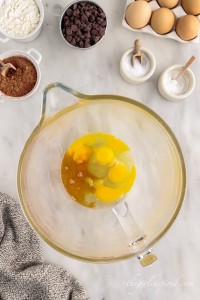 eggs and vanilla in a glass mixing bowl