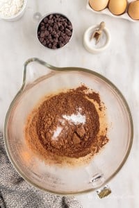 dry brownie ingredients in a glass bowl