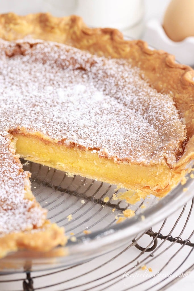 chess pie on a wire rack with a slice taken out