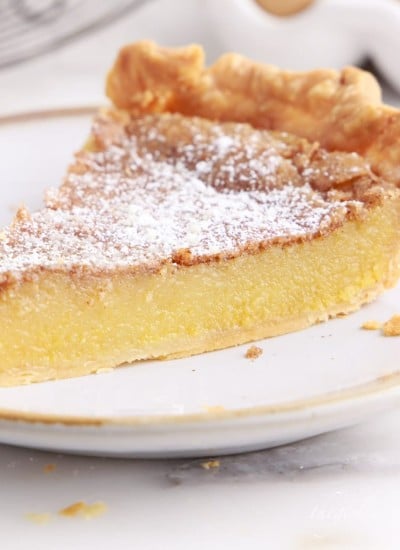 chess pie on a plate dusted with powdered sugar