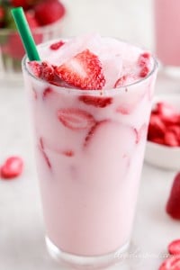 copycat pink drink in a glass with green starbucks straw