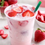 starbucks pink drink with strawberries on top