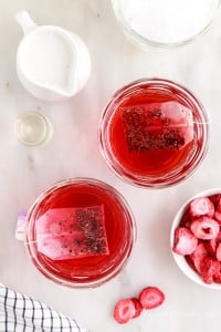 two cups of passion tea steeping in glasses to make starbucks pink drinks