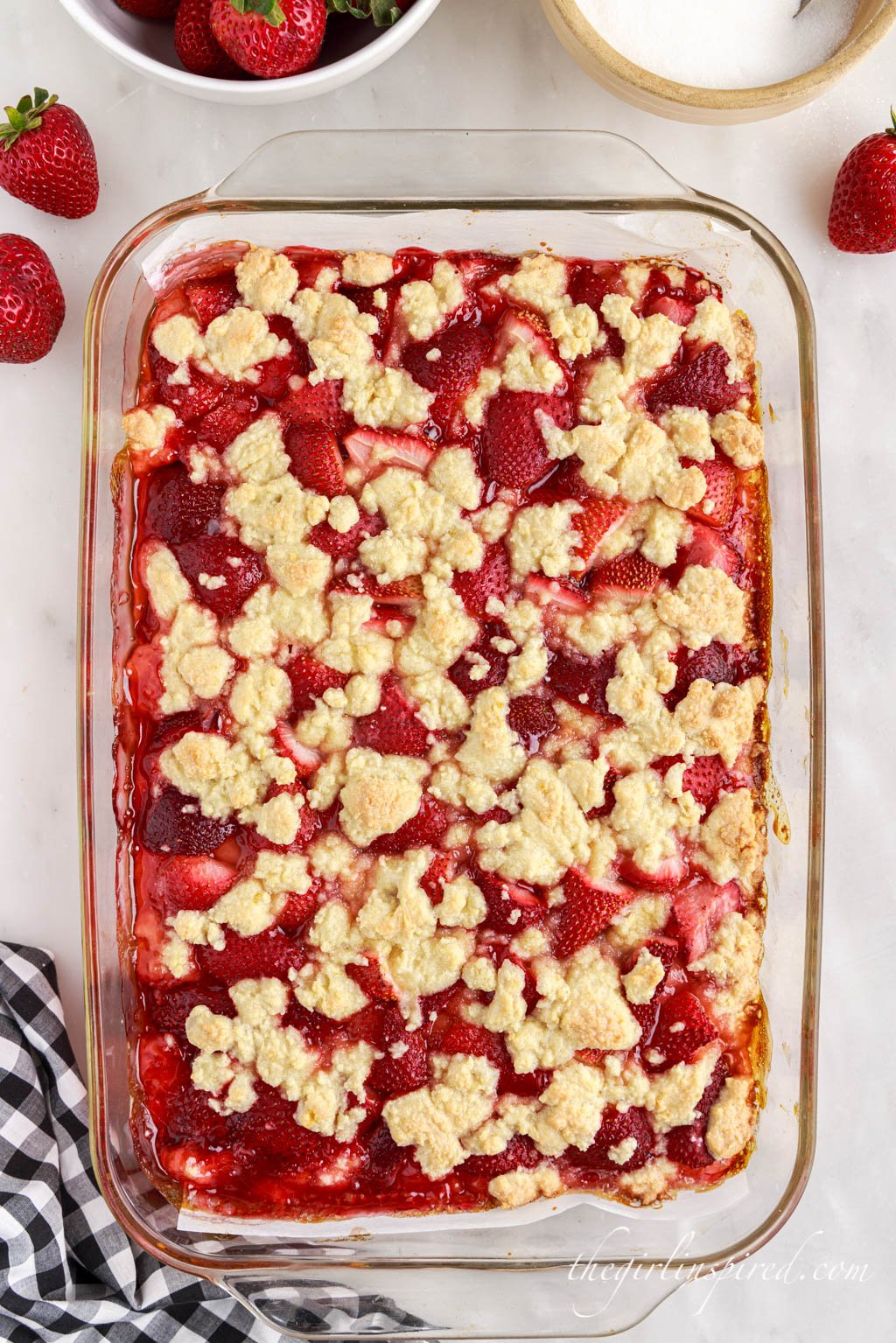 baked strawberry bars in a glass pan