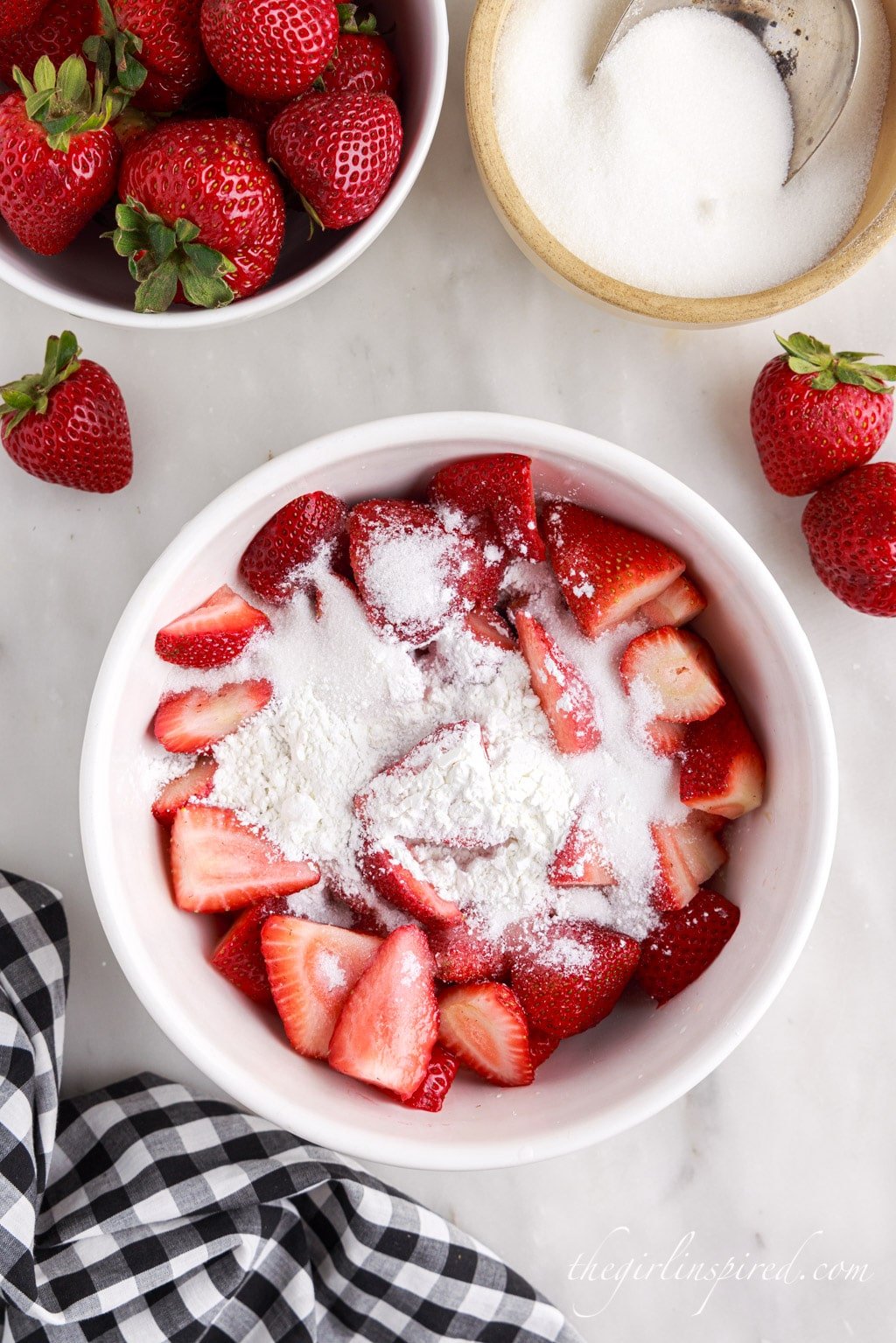 strawberries in a bowl topped with sugar