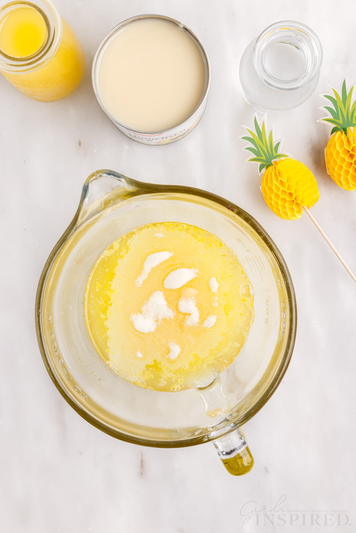 pineapple jello mix and water in a glass mixing bowl to make dole whip shots