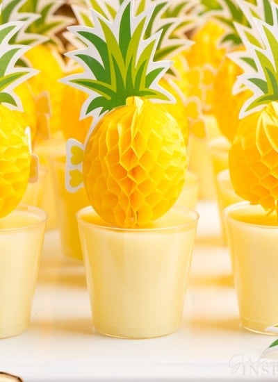 close up of dole whip jello shots with party pineapple toppers in each one