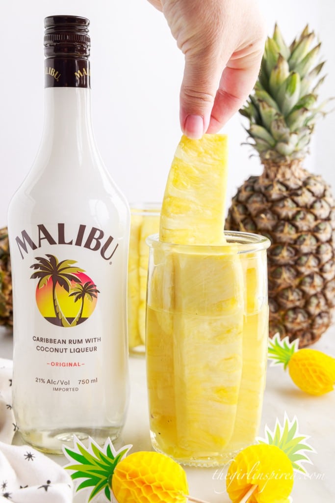 getting a pineapple spear out of the rum