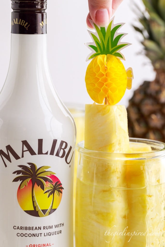 Pineapple Spears in a jar Malibu Rum with a pineapple drink topped pushed in the top