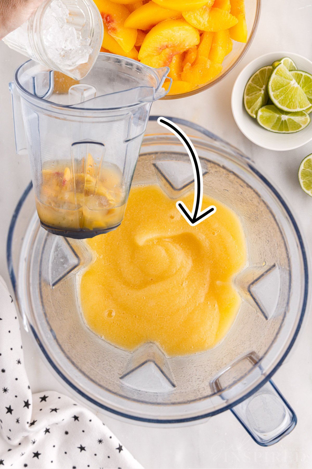 Adding ice to blender and blended peach margaritas.
