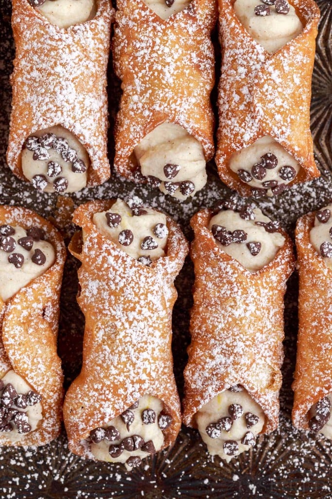 top view of finished cannoli dusted with confectioners sugar