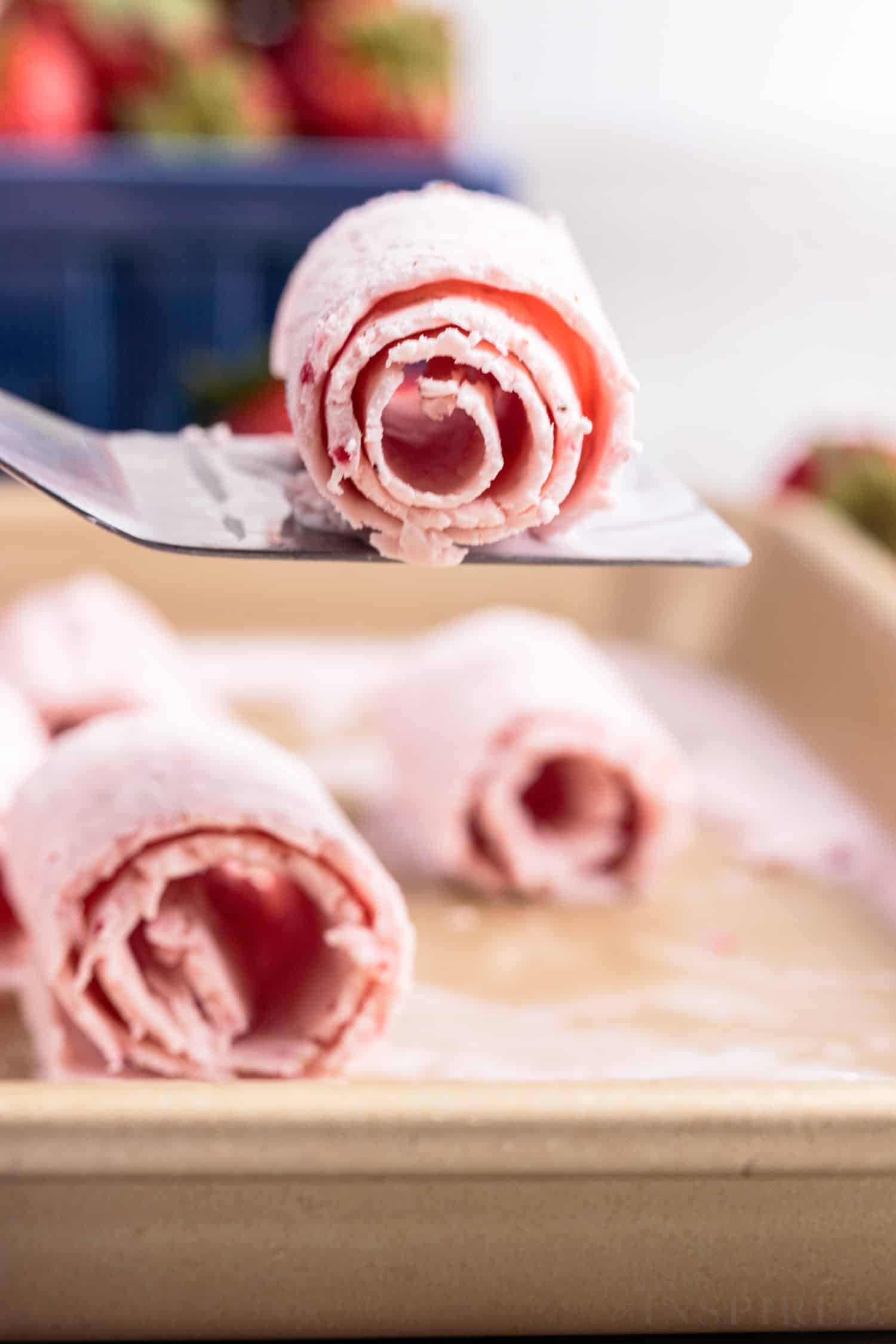 several rolls of strawberry ice cream
