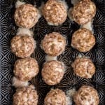 a baking sheet full of oven baked meatballs.