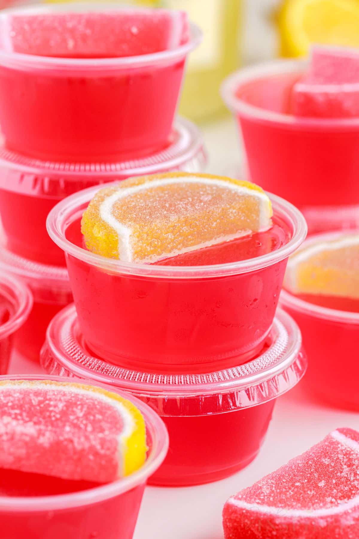 close up of the jello shots some with lids some without