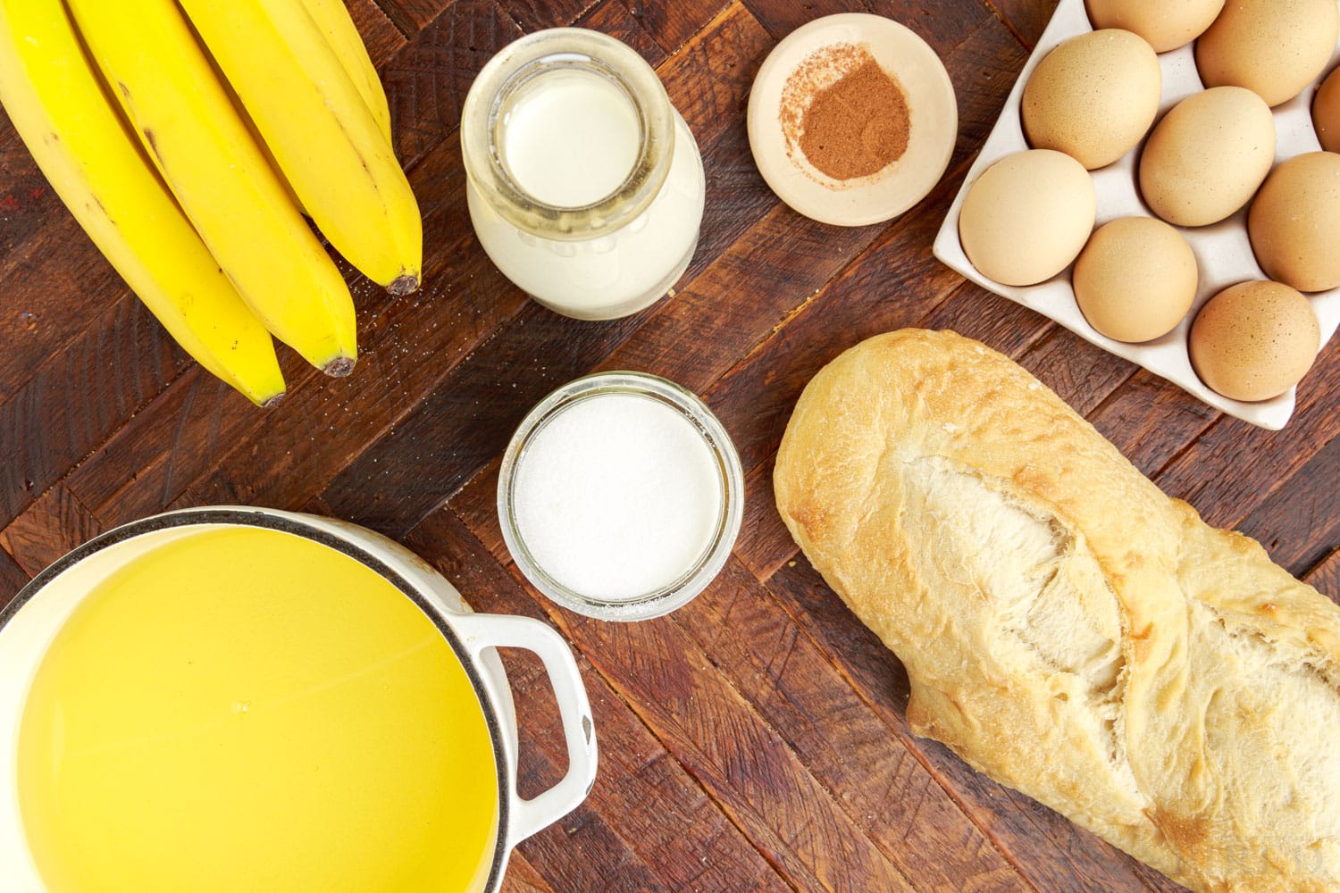 ingredients needed to make copycat tonga toast - eggs, cinnamon, sugar, milk, bananas, butter and baguette