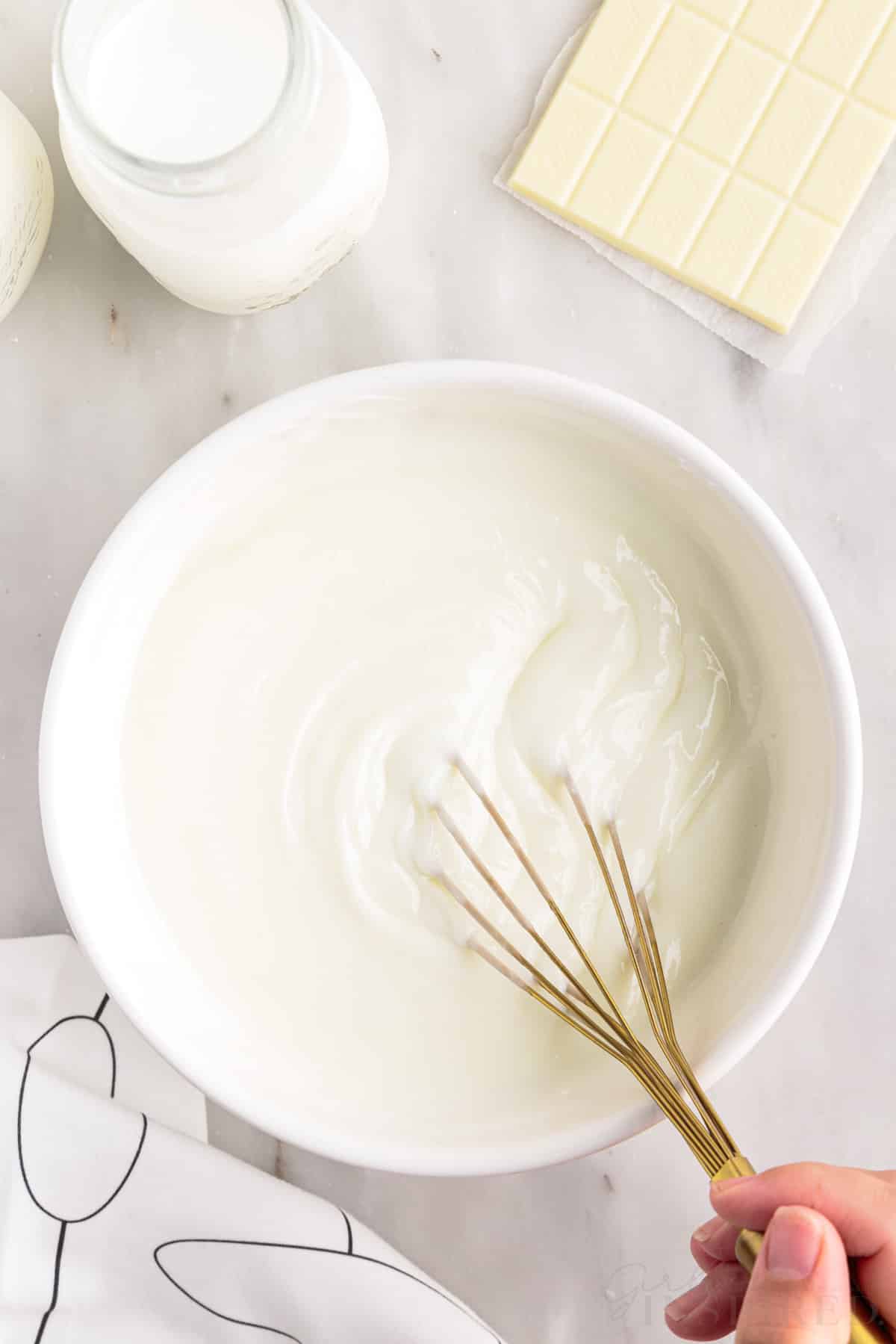whisking the pudding and milk together