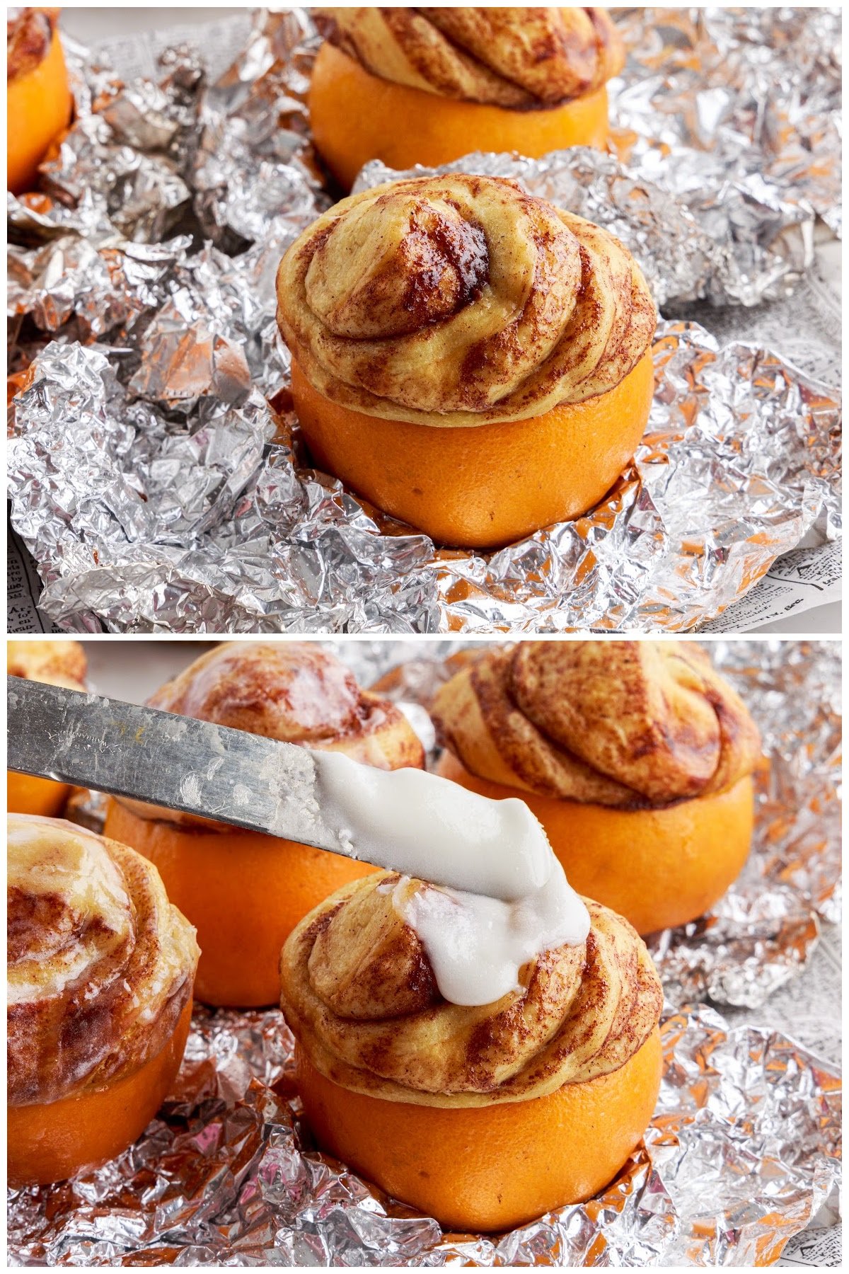Baked and puffy campfire cinnamon roll set on aluminum foil with frosting being applied to top.