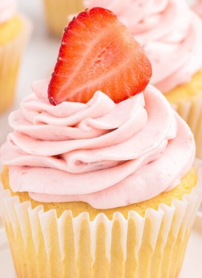 Cupcake with strawberry cream cheese frosting.