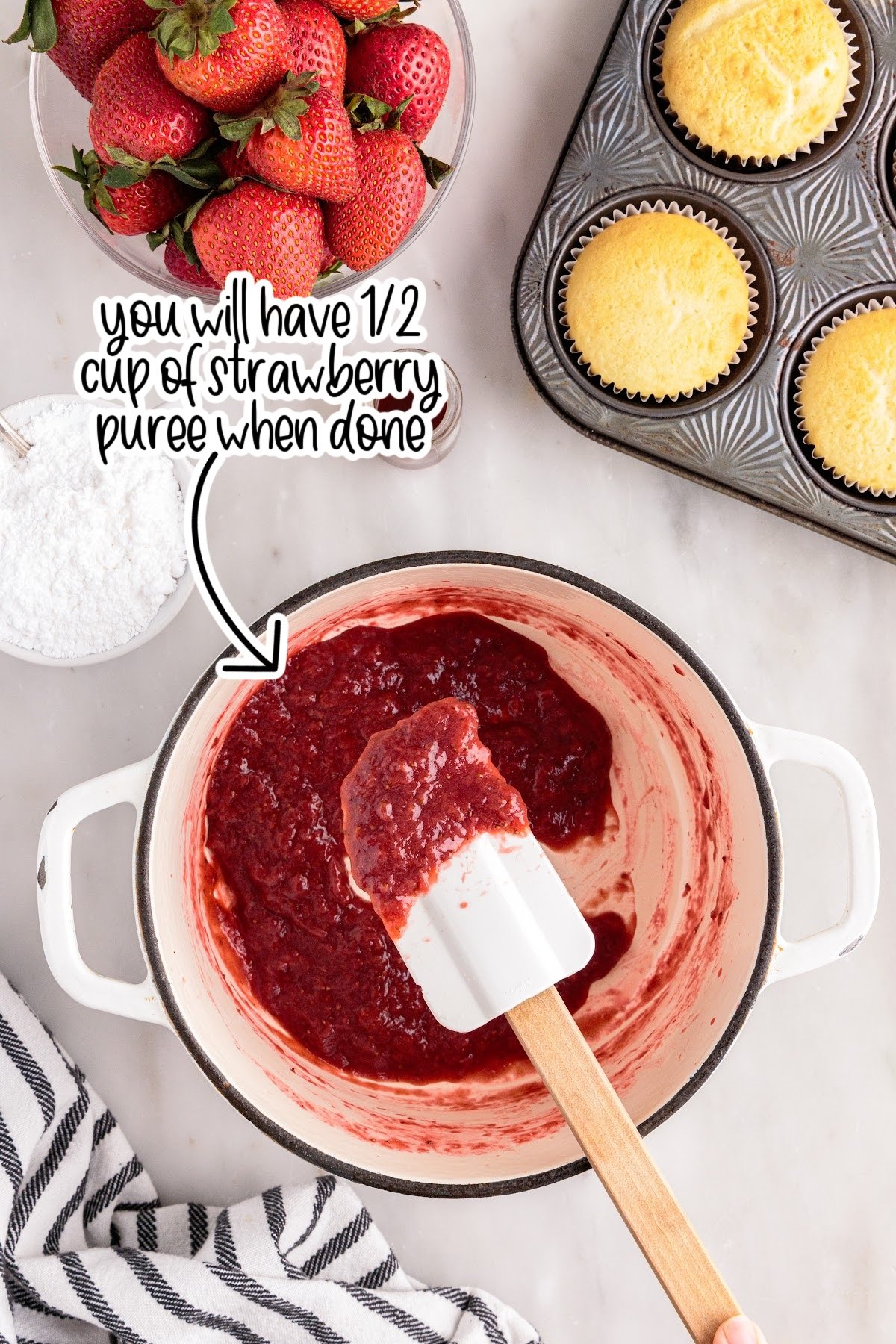 Strawberry reduction in saucepan and on spatula with text overlay "you will have ½ cup of strawberry puree when done."