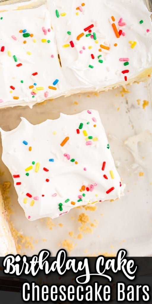 Close up of a birthday cake cheesecake bar in a glass baking dish, on top of a white marble surface.