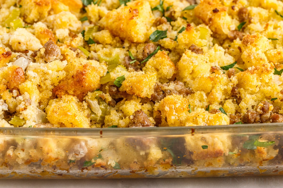 side view of cooked cornbread sausage stuffing with parsley on top