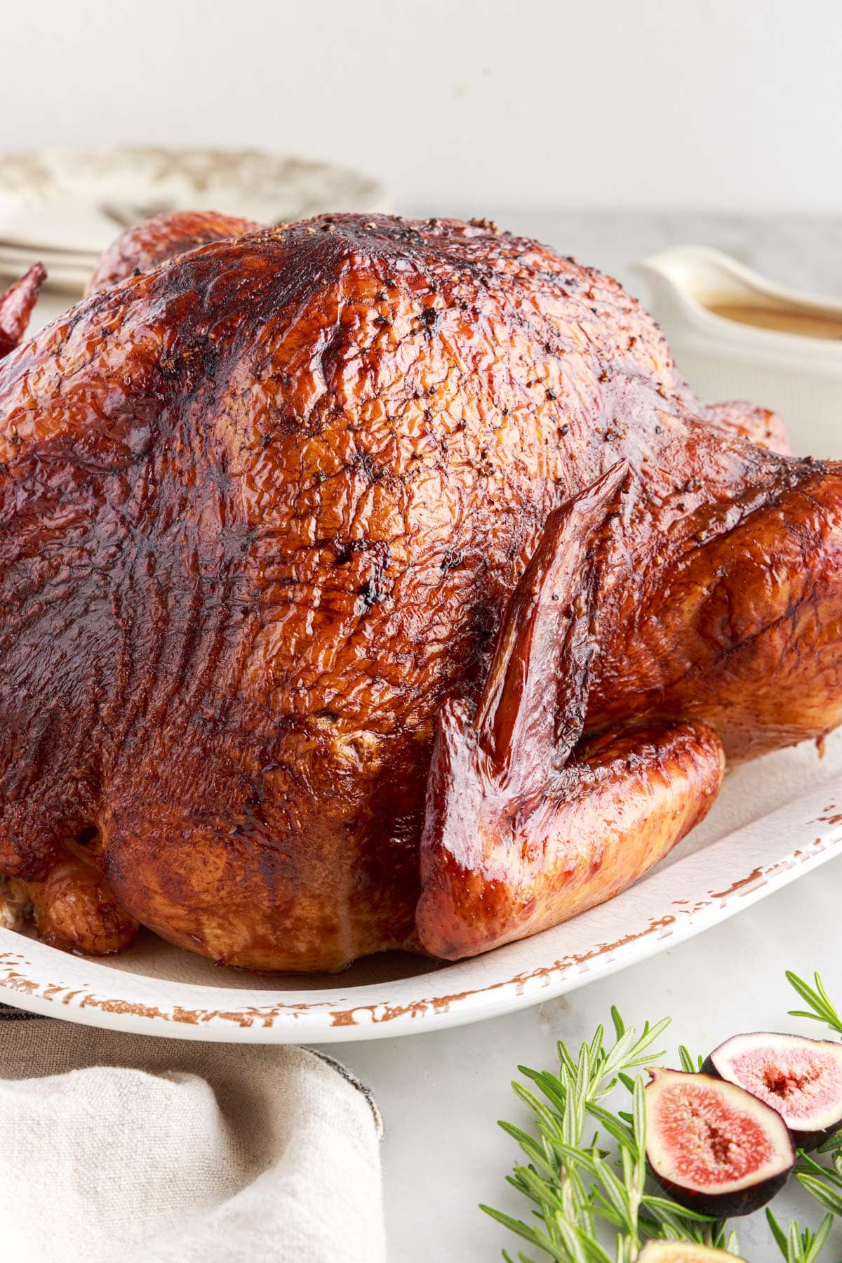 front side view of the smoked turkey on a platter