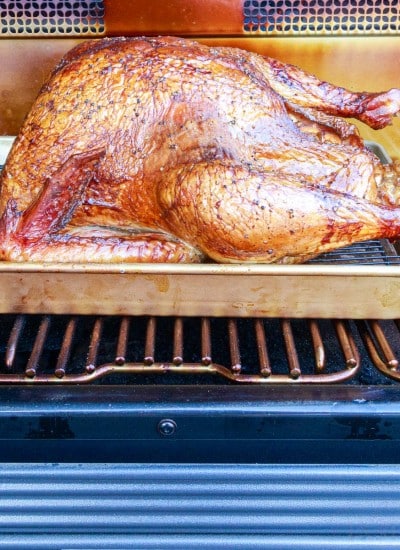 close up of browned easy smoked turkey on the smoker