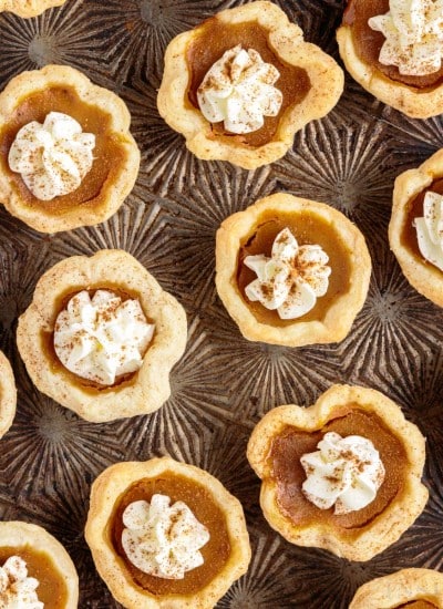 top view of pumpkin pie bites topped with whipped cream