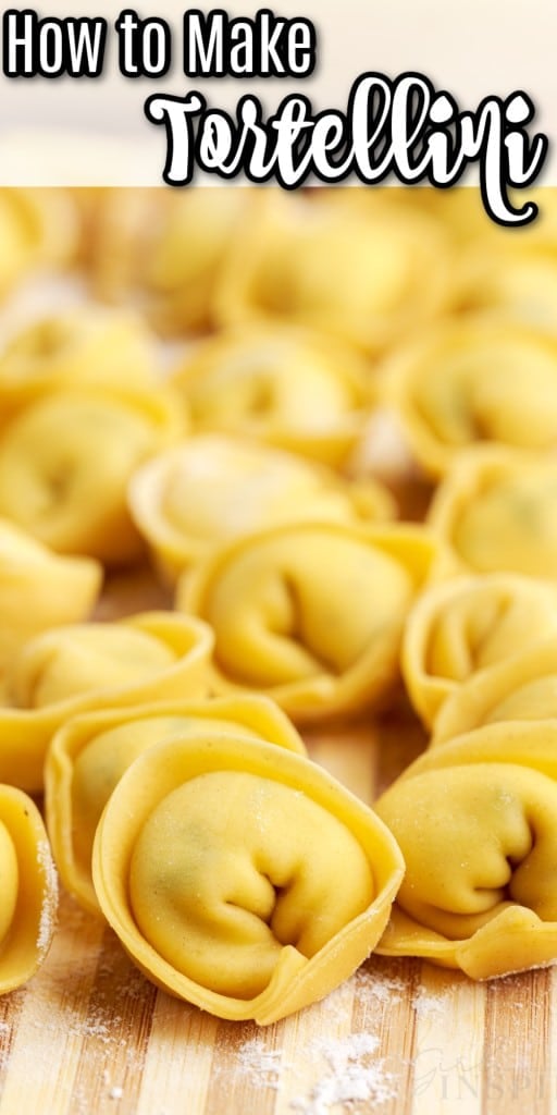 close up view of uncooked tortellinis on a wooden kitchen board