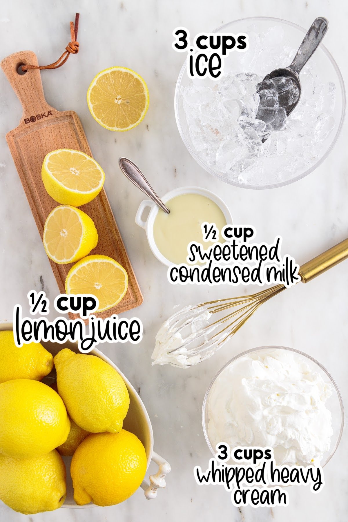 Bowl of ice, bowl of lemons, lemons on a cutting board, whipped cream with whisk, bowl of sweetened condensed milk - all ingredients to make whipped lemonade with text and amount labels.