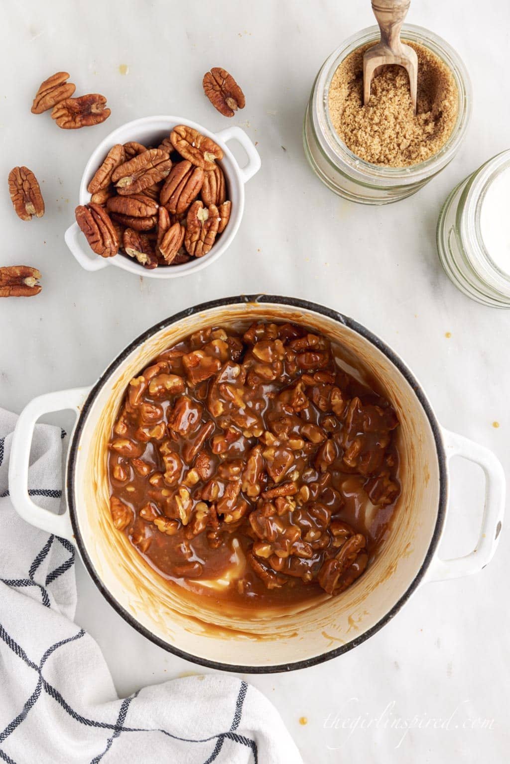 pecans and caramel mixed together in saucepan