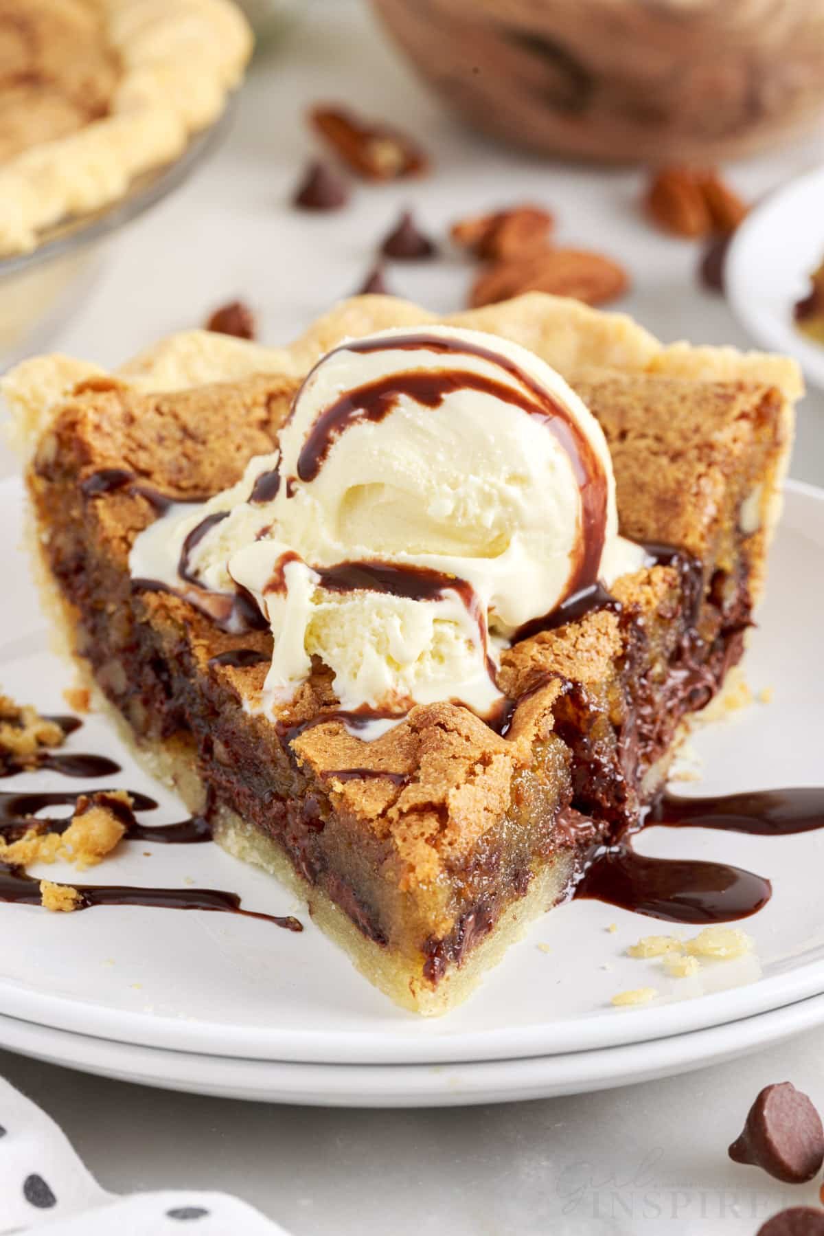 slice of chocolate chip pie with ice cream