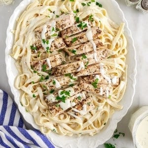 grilled chicken alfredo on an oval platter