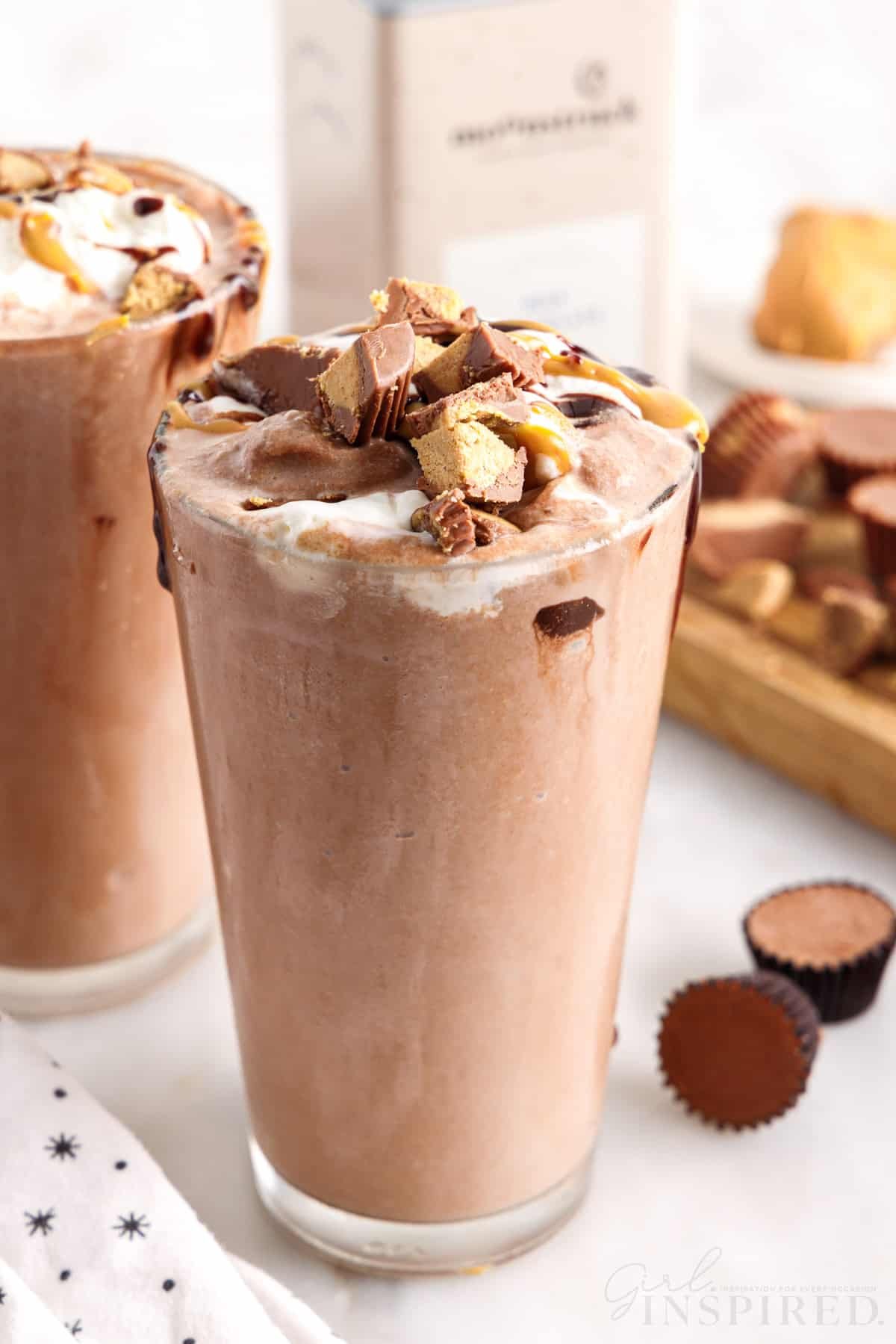 two glasses of peanut butter frozen hot chocolates