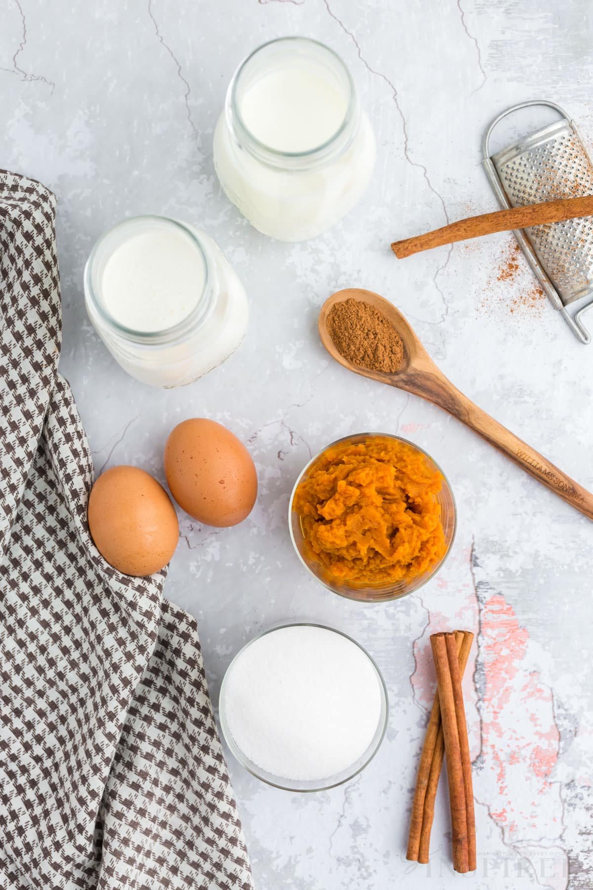 individual ingredients for pumpkin ice cream set out.