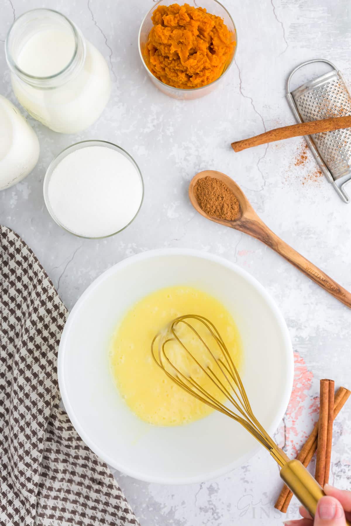 whisking eggs in bowl.