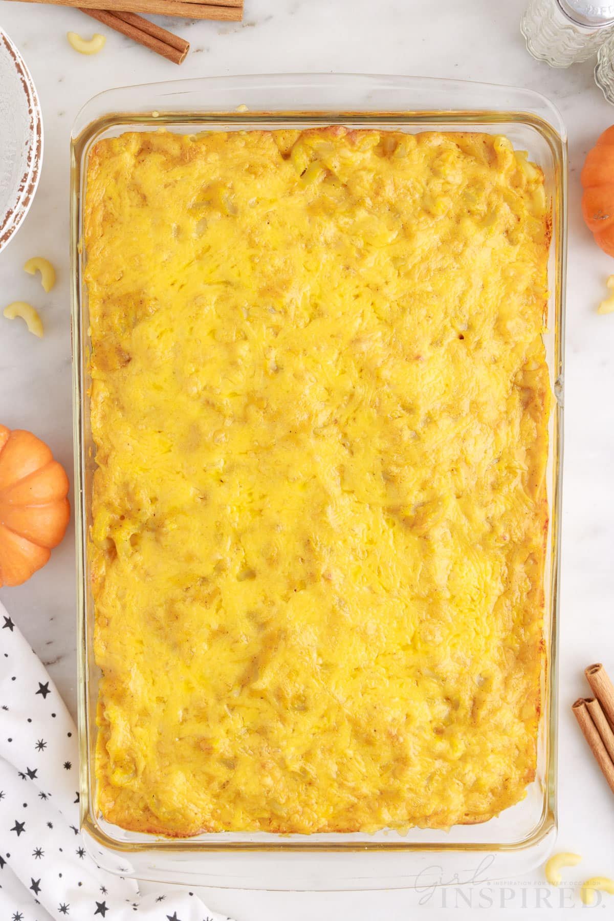 baked pumpkin spice mac and cheese in a 9 x 13 baking dish