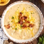 bowl of bacon cheeseburger soup topped with bacon and cheese