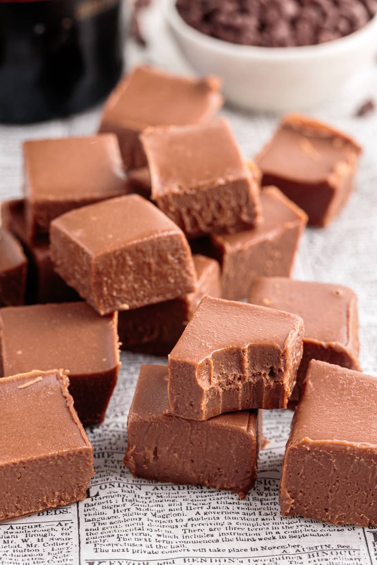 stacked cubes of baileys fudge with a bite out of a piece