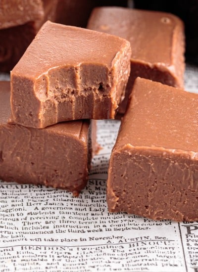 close up of pieces of baileys fudge with a bite taken out of one piece