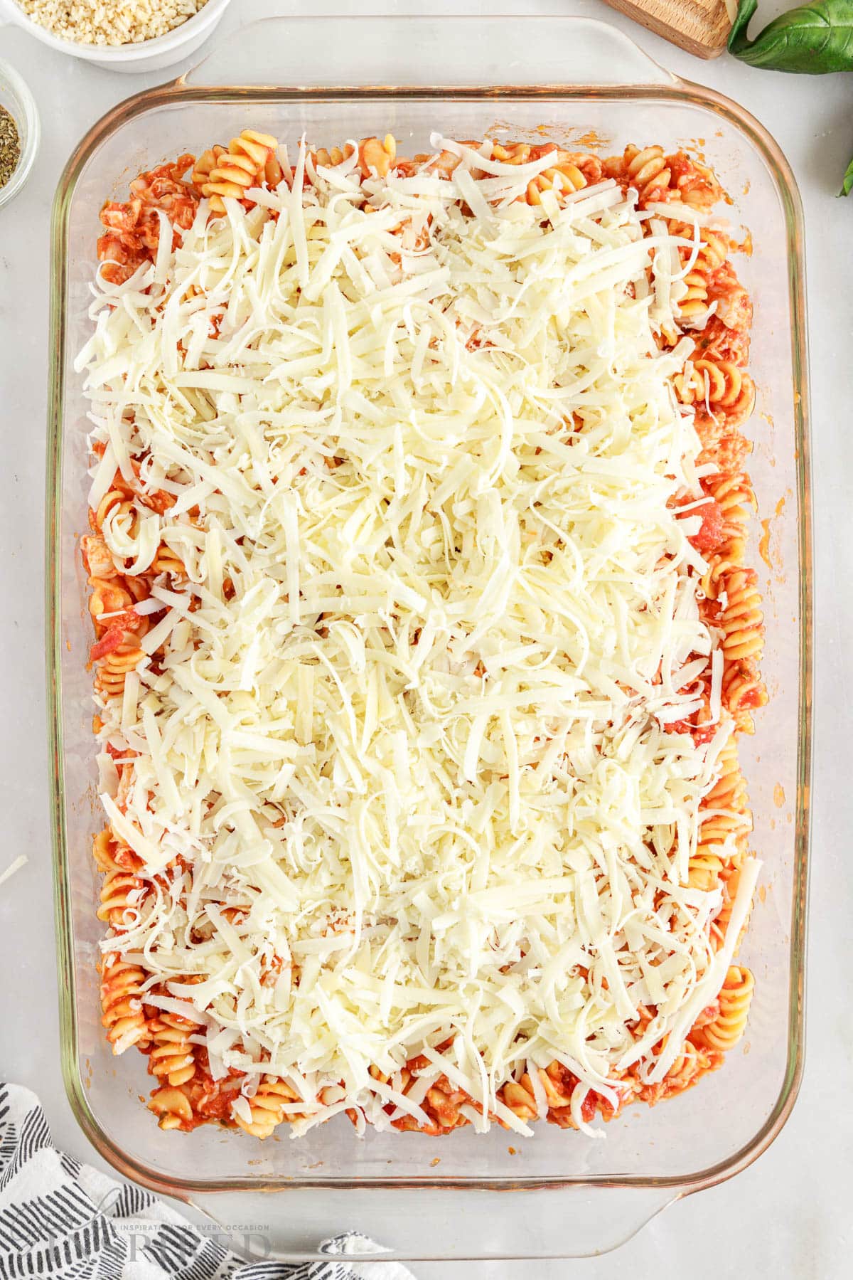 chicken parmesan pasta bake with mozzarella cheese in 9x13