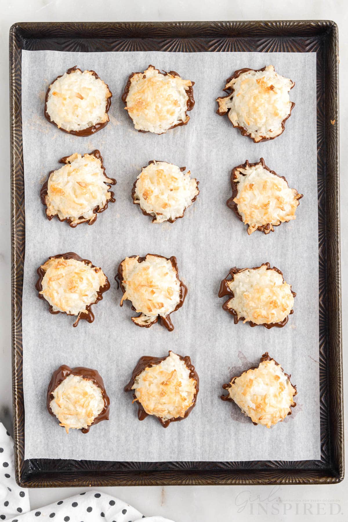 finished coconut macaroons on parchment paper lined cookie sheet
