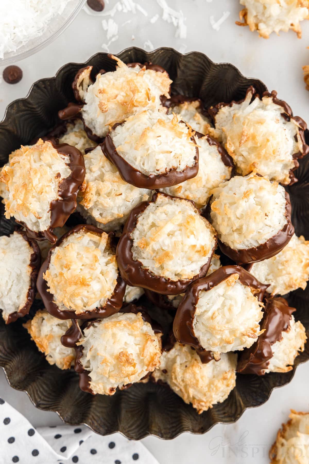 top view of stacked coconut macaroons on a decorative round dish