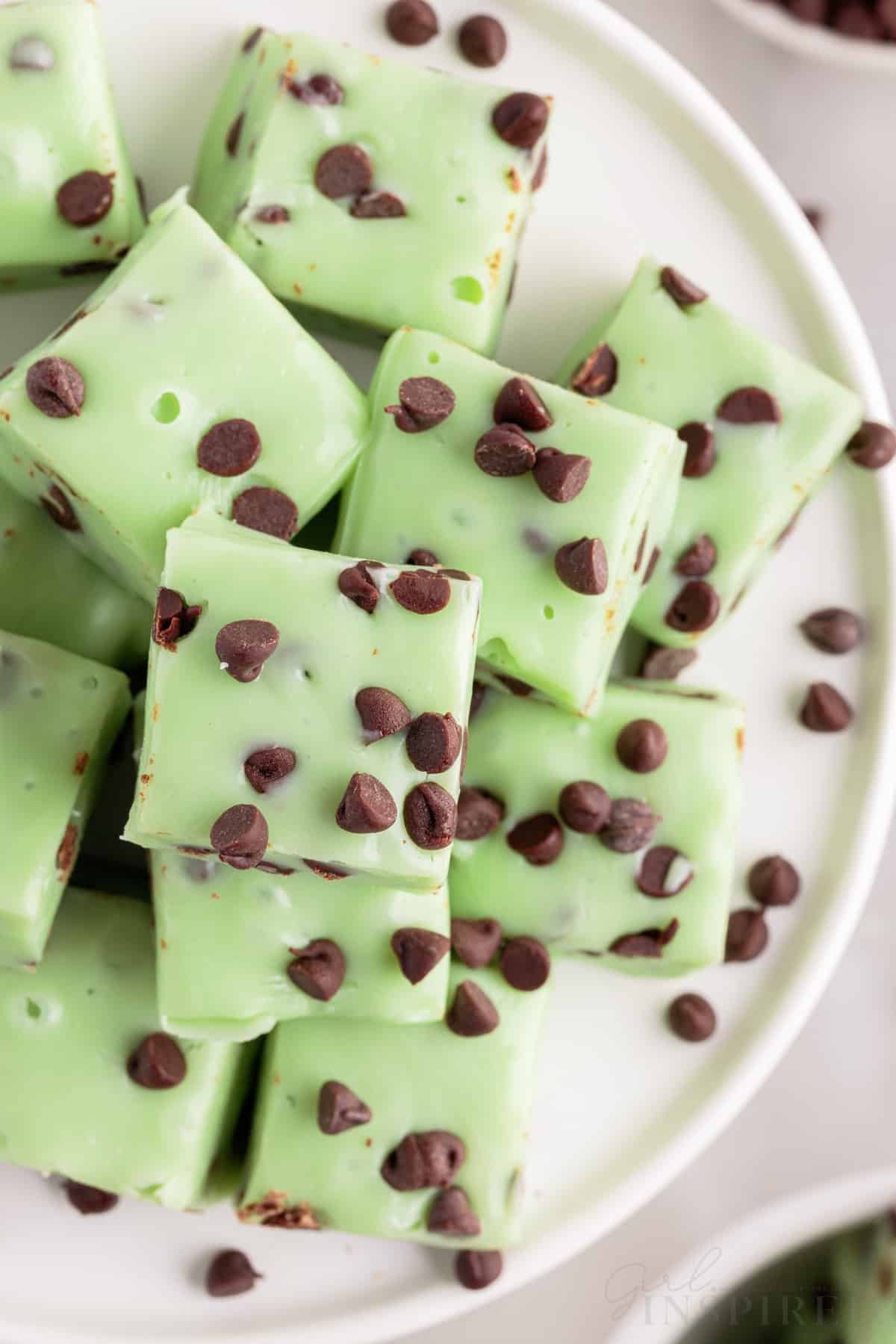 top view of mint chocolate chip fudge cubes on a white tray