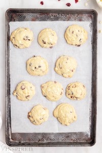cookie sheet with baked white chocolate cranberry cookies