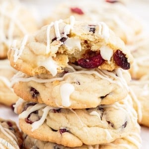 close up of white chocolate cranberry cookies a bite taken from the top one