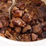 zoomed view of crockpot steak bites with spoon