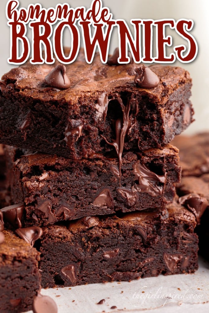 three stacked brownies with a bite taken from the top brownie